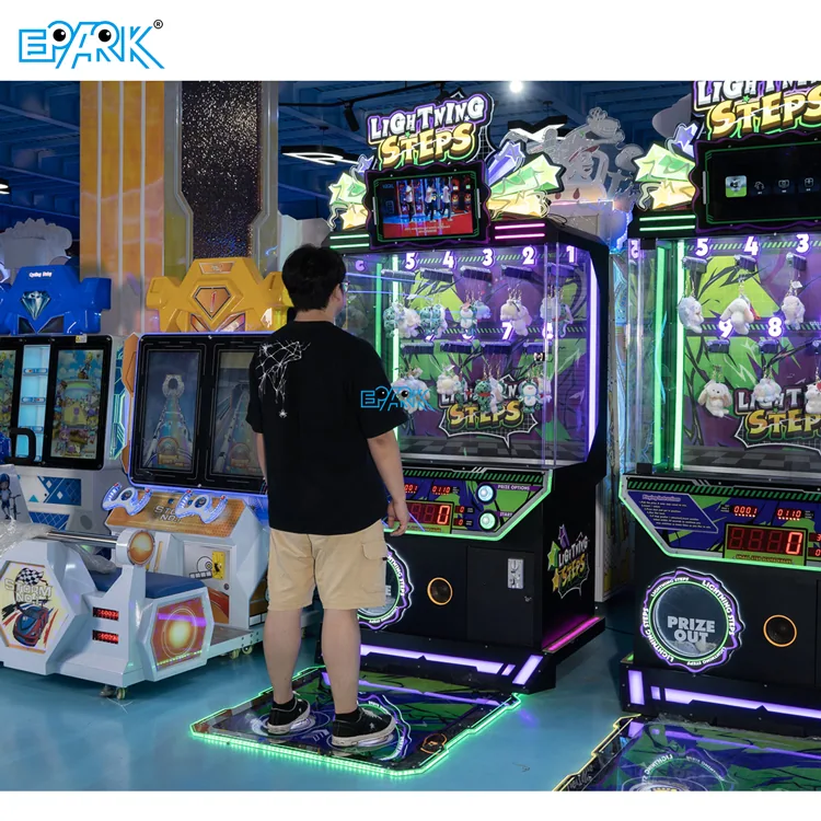 Player using the illuminated foot controls on the prize challenge machine