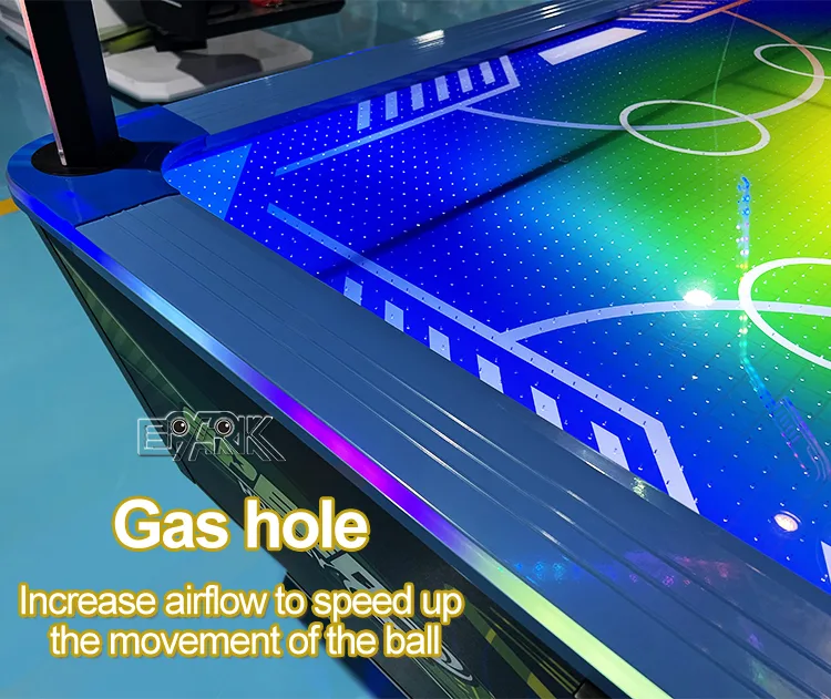 Airflow holes and illuminated edge on the four-player hockey playfield