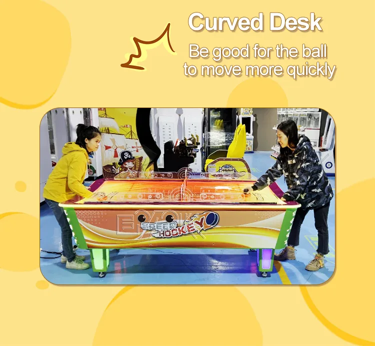 Two players competing on the large curved air hockey table