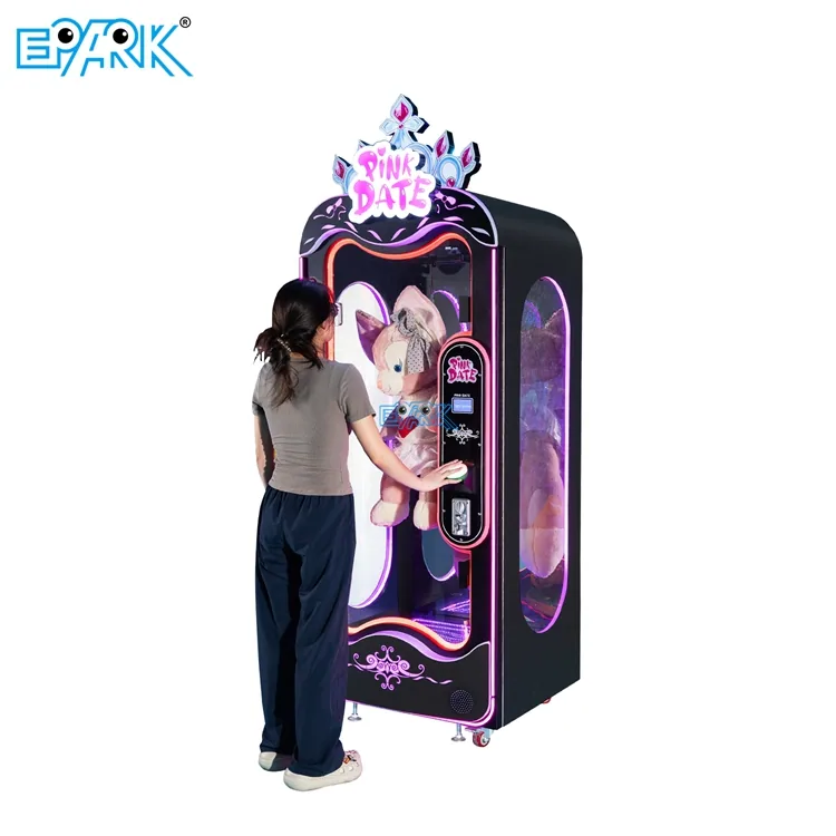 Player using a large-toy scissor prize machine in an arcade