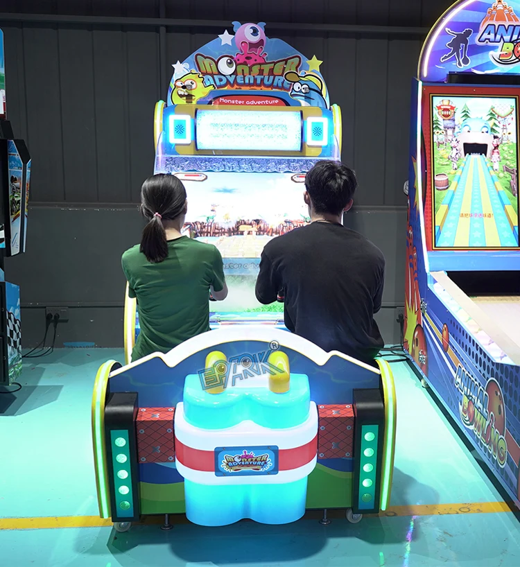 Two players using the water shooting arcade machine in the showroom
