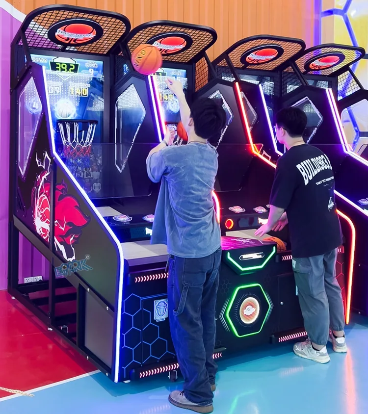 Two players using a 65-inch basketball arcade game in a venue
