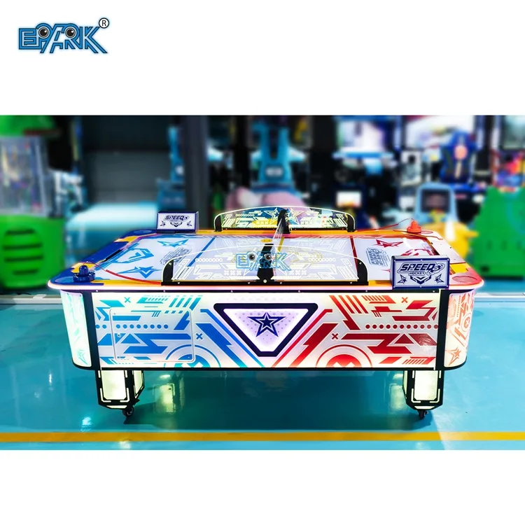 Illuminated two-player air hockey table in an arcade showroom