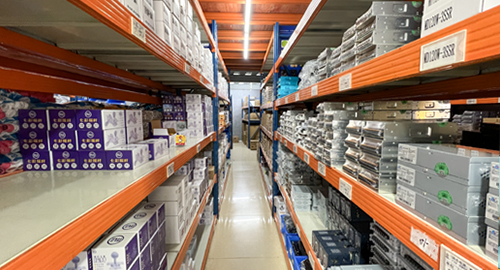 Organized arcade machine components in the EPARK parts storage area