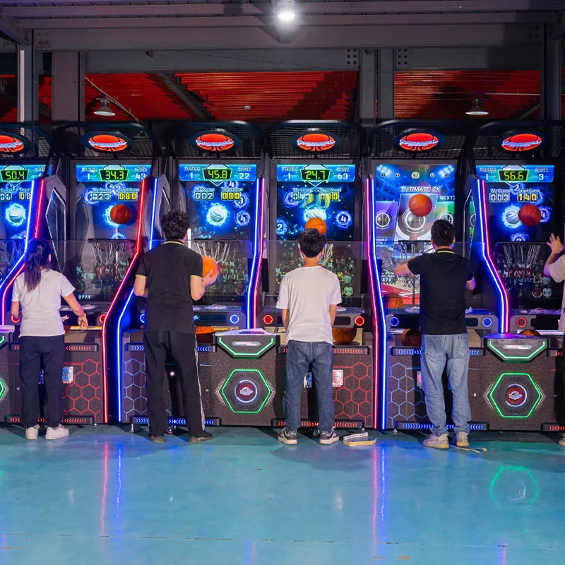 Players using a row of EPARK commercial basketball arcade machines