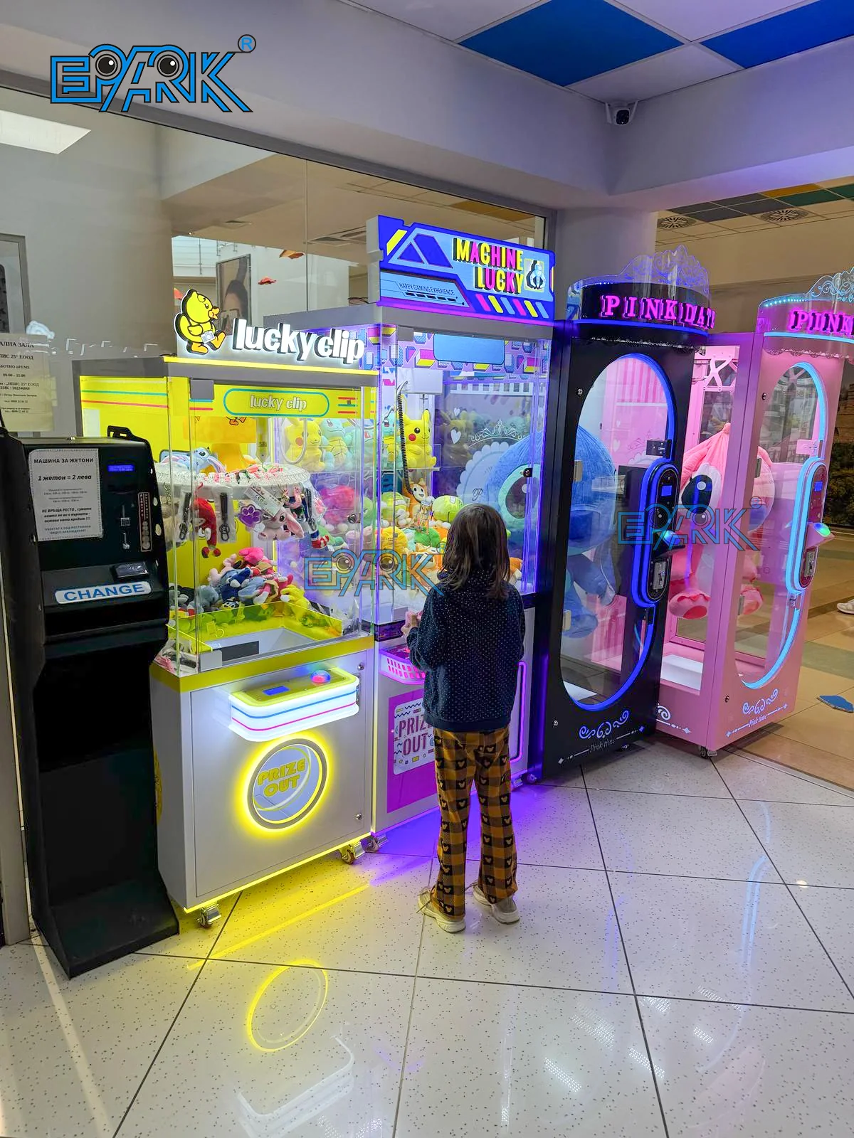 Customer using claw and large-prize machines in a shopping mall in Bulgaria