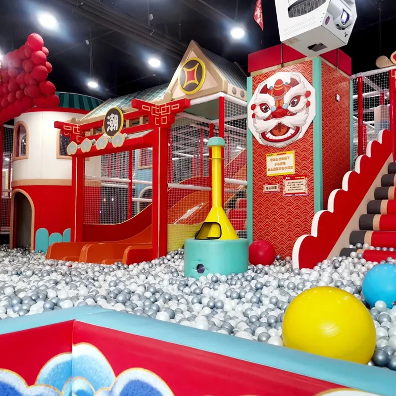 Indoor soft playground with ball pit, slides and climbing structures